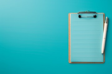 Top view of a clipboard with blank paper and pen on blue background, ready for notes or checklists in a minimalist workspace.