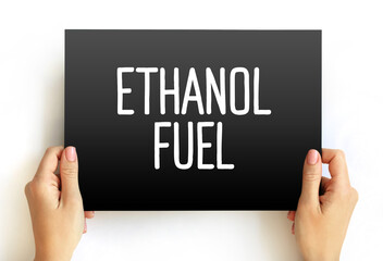 Ethanol Fuel - renewable fuel made from various plant materials collectively known as biomass, text concept on card