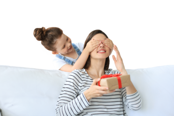 Little girl make birthday present to excited parent , smiling little child congratulate give gift box to happy mother and closed mother's eyes on a transparent background