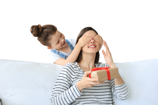 Little girl make birthday present to excited parent , smiling little child congratulate give gift box to happy mother and closed mother's eyes on a transparent background
