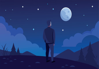 A man stands on a hill looking at the moon