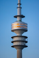 Close up photo of the Olympiaturm in Munich, Germany during sunset