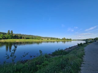 walking next to the Elbe River in Dresden, the capital of Germany at late afternoon