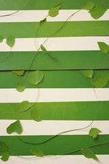 Green vines growing on a striped background.