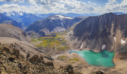 Mountain landscape, Altai. Lake in a deep gorge, summer travel in the mountains.