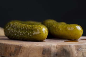 green cucumbers pickled in vinegar