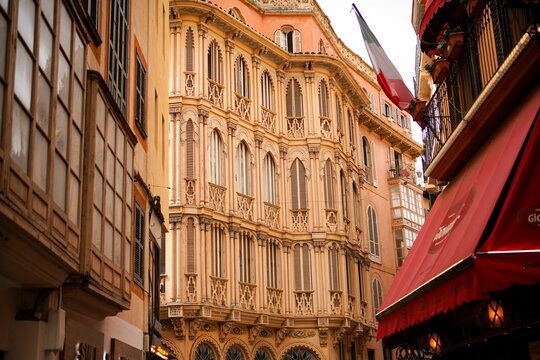 a tall building with a clock on it in a city