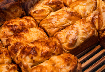 Delicious bread placed on wooden shelves, these breads have exquisite shapes