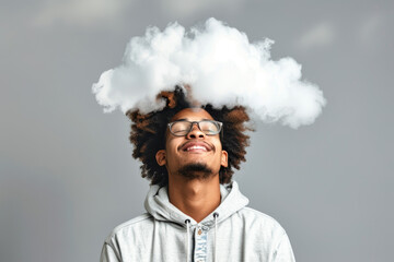 A man with glasses and dreadlocks is smiling and has a cloud on his head. Concept of happiness and lightheartedness