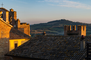 Gradara, Italy - August, 25, 2022: sunset view of gradara rooftops and countryside