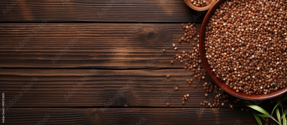 Poster Copy space image of buckwheat groats on a rustic wooden background creating an abstract depiction