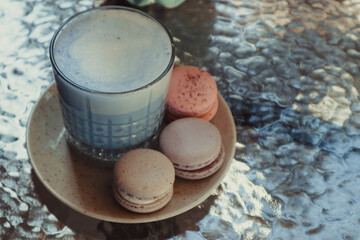 Tasty macaron cookies and blue matcha latte