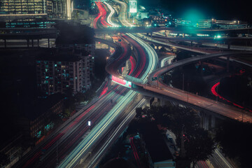 Rush traffic light trails at night in urban city area