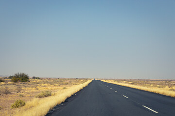 long empty highway in desert area in desert area during daytime: Namibia
