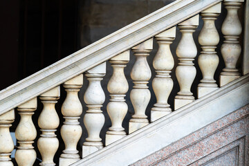 closeup of ornate stone staircase balusters with classic design, showcasing craftsmanship