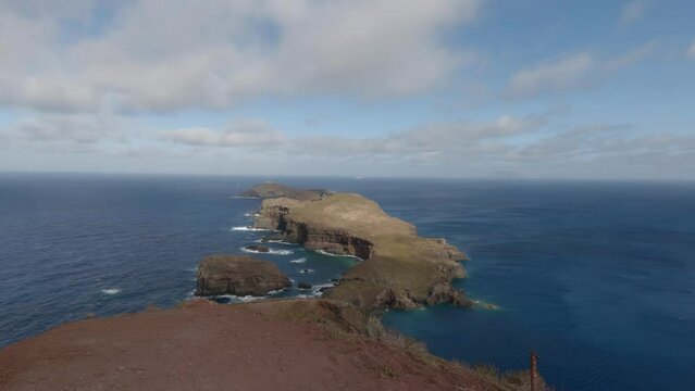 Scenic view of the island of Ilheu Da Cevada on a sunny day in Madeira Island, Portugal