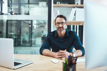 Fototapeta premium Mature, businessman and glasses in office with portrait for justice, technology for work on legal job. Male attorney, laptop and law firm with court case on climate mobility, advocate for change