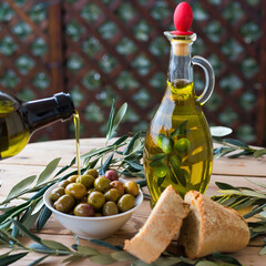 olive oil, extra virgin olive oil in a glass bottle, on a wooden table.