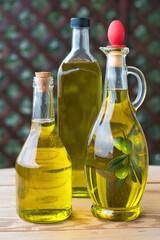 olive oil, extra virgin olive oil in a glass bottle, on a wooden table.