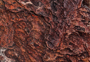 Top view.The surface of the rock is dark brown rough suitable for use as a background. 
