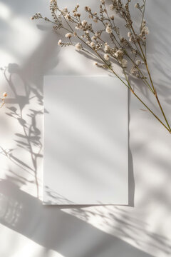 A white card with a flower on it