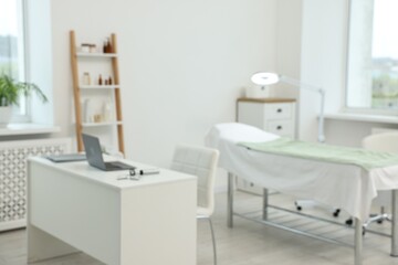 Modern interior of dermatologist's office with examination table