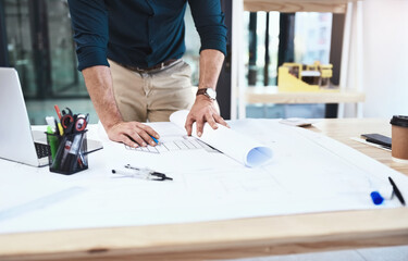 Architect, hands and blueprint on desk for drawing, sketch and construction design in office....