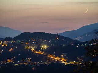 the city at night from the hills of the resort, which looks like it has