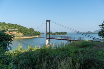 Fototapeta premium Kraeg Krachen National Park headquarters supsension bridge over the lake.