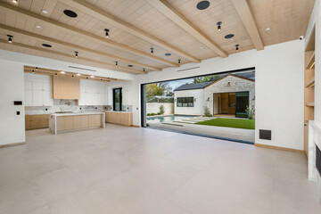 a room with a fireplace in it and a wall with windows