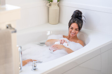 Woman enjoying a soothing bath.