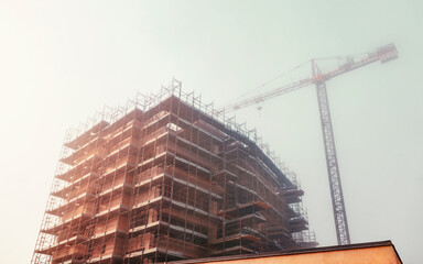 Construction site, building under construction, foggy