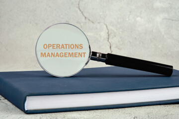 Operations management business concept. OPERATIONS MANAGEMENT written. through a magnifying glass...