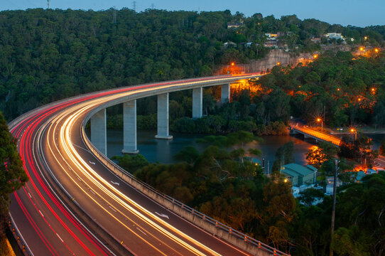 Curved bridge with car lights in a long exposure
