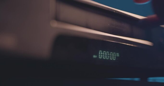 Playing a VHS tape in a VCR video recorder