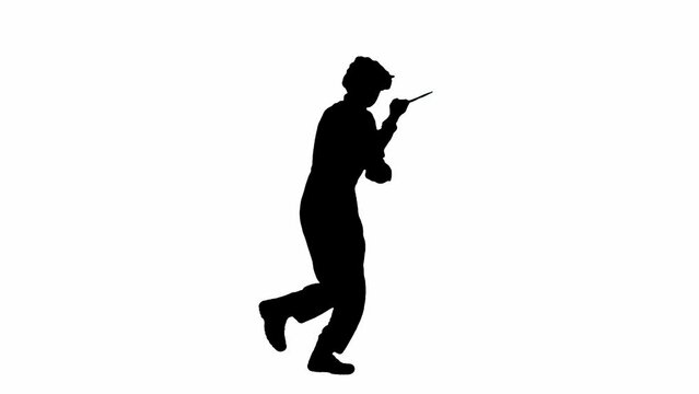 Black silhouette of maniac man in jumpsuit running with knife in hand. Unrecognizable man with curly hair on white isolated background. Side view.