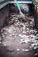 spade and gravel residues lie on an old bitumen roof covering
