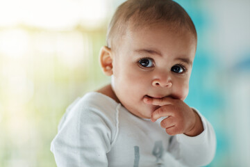 Teething, baby and face of infant in home with development of health and growth with wellness....