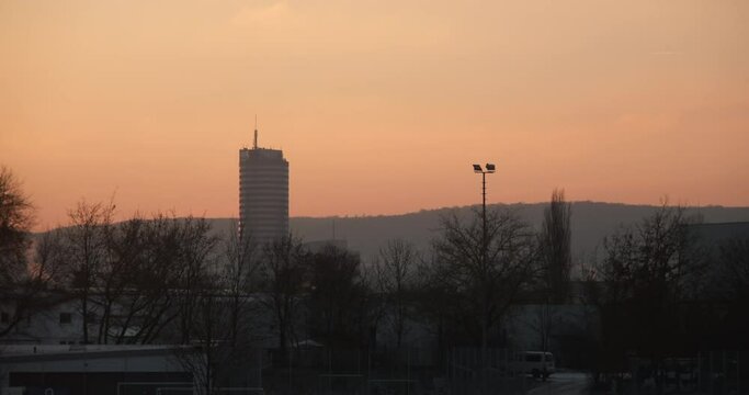 View of the JenTower with mountains under dusk sky in Jena city, Thuringia, Germany