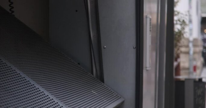 Closeup footage of closing an automatic gate of an underground parking garage in Jena, Germany
