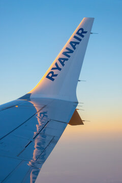 Ryanair's logo on the wing of the plane during sunrise.
