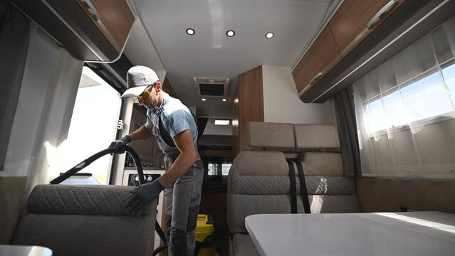 Man Cleaning Inside of RV Camper Van