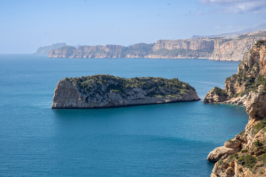 Cap de la Nau, beautiful views of the cliffs and the blue sea of Alicante, on the Gulf of Valencia, Mediterranean Sea, Spain 