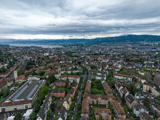 Aerial view of Swiss City of Z&uuml;rich with cityscape and skyline with Lake Z&uuml;rich in the background on a cloudy spring day. Photo taken May 17th, 2024, Zurich, Switzerland.