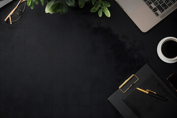 Elegant workspace with laptop, glasses, coffee, plant, and black notepad with gold pen