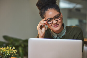 Business woman, portrait and laptop at night for company, planning and market research in office. Web designer, smile and technology for web design, coding and programming with digital transformation