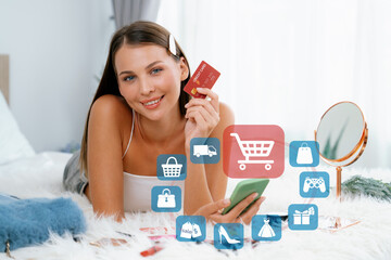 Elegant customer wearing white tank top holding credit card typing phone choosing online platform....