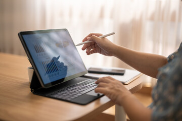 A person is using a laptop with a stylus to draw on a screen