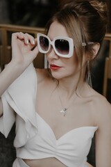 A young couple in wedding looks posing in a stylish loft bar.