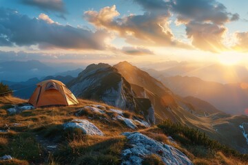 A tent is sitting on top of a mountain at sunset